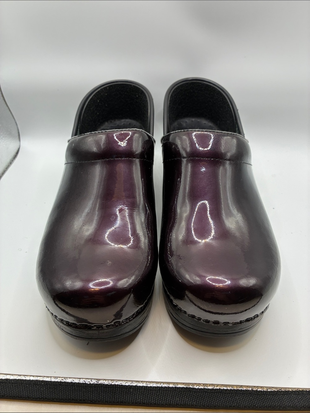Dansko Women's Patent Slip-On Clogs in Plum